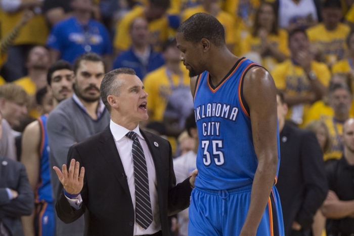 Oklahoma City Thunder head coach Billy Donovan (left) talks to forward Kevin Durant (35) during the fourth quarter in game seven of the Western conference finals of the NBA Playoffs against the Golden State Warriors at Oracle Arena. The Warriors defeated the Thunder 96-88, Oakland, California, May 30, 2016.