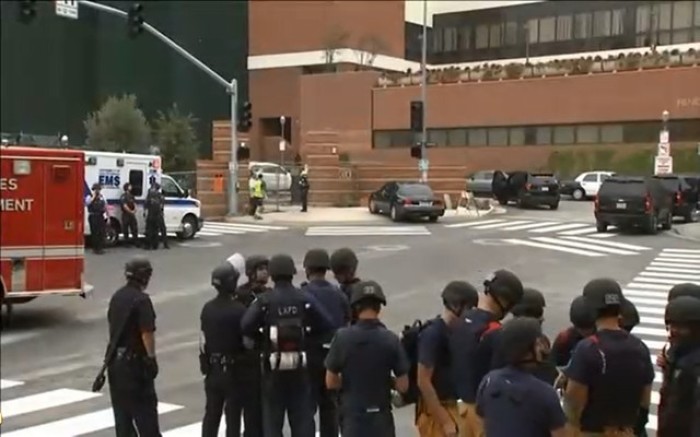 Police and first responders gather outside the University of California, Los Angeles, California, following a shooting.