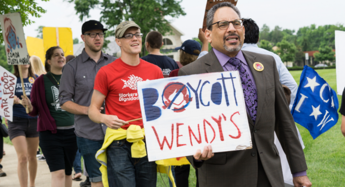Tony De La Rosa, interim executive director of the Presbyterian Mission Agency of Presbyterian Church (USA), takes part in a protest held outside of Wendy's headquarters in Dublin, Ohio, May 26, 2016.