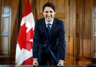 Canada's Prime Minister Justin Trudeau poses at his desk following an interview with Reuters in his office on Parliament Hill in...