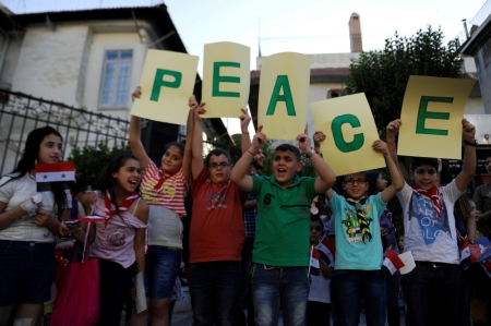 Children hold up letters spelling the word 'Peace' during a day of activities and prayers at the Zaitoune historic church in old Damascus, in response to a call from Pope Francis for a peace prayer for children in the war-torn country, Syria, June 1, 2016.
