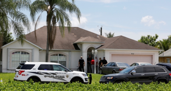 Police stand in front of one of the houses that officials indicated was connected to the Orlando shooter in Port St. Lucie, Florida, U.S. June 12, 2016.
