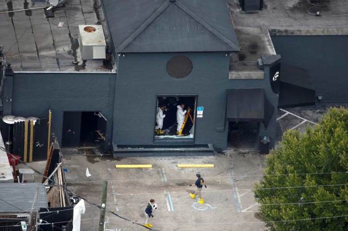 Federal Bureau of Investigation (FBI) officials collect evidence from the Pulse gay night club, the site of a mass shooting days earlier, in Orlando, Florida, U.S., June 15, 2016.