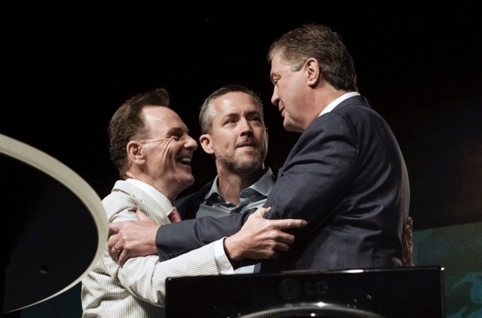(Left to right) Outgoing Southern Baptist Convention President Ronnie Floyd together with presidential nominee J.D. Greear congratulate president-elect Steve Gaines, pastor of Bellevue Baptist Church in Cordova, Tenn., after he is elected president of the SBC by acclamation after Greear withdrew from the race and moved that the convention elect Gaines by acclamation during the SBC's annual meeting at America's Center in St. Louis Wednesday, June 15.