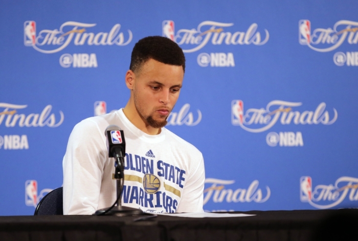 Golden State Warriors guard Stephen Curry (30) reacts while speaking to media following the 93-89 loss against the Cleveland Cavaliers in game seven of the NBA Finals at Oracle Arena, Oakland, California, June 19, 2016.