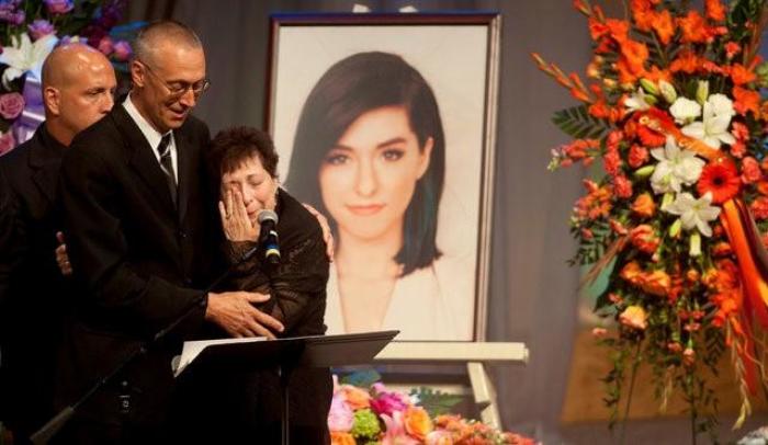 Tina Grimmie, mother of musician Christina Grimmie, is comforted by her husband Bud as Tina speaks during a memorial service held for the singer at Fellowship Alliance Chapel in Medford, New Jersey, U.S. June 17, 2016.
