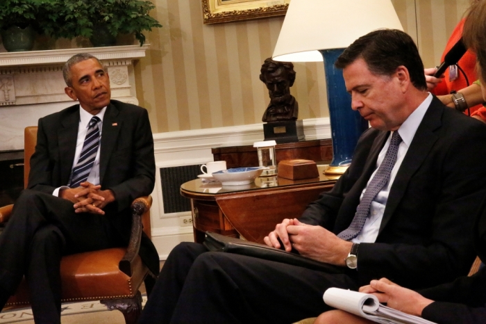 U.S. President Barack Obama attends a meeting with FBI Director James Comey (R) along with DHS Secretary Charles Johnson (not pictured), NCTC Director Nicholas Rasmussen (not pictured), and Deputy Attorney General Sally Yates (not pictured) at the Oval Office of the White House in Washington, U.S., June 13, 2016.