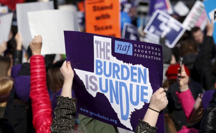 Pro-abortion protesters demonstrate in front of the U.S. Supreme Court as the court takes up a major abortion case in Washington, in this file photo taken March 2, 2016.