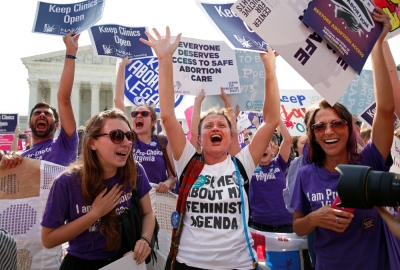 Demonstrators celebrate at the U.S. Supreme Court after the court struck down a Texas law imposing strict regulations on abortion doctors and facilities that its critics contended were specifically designed to shut down clinics in Washington June 27, 2016.