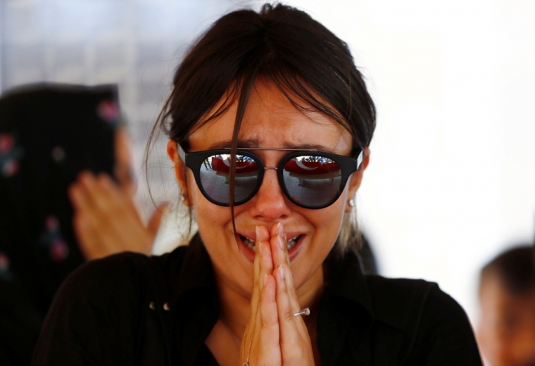 A friend of Gulsen Bahadir, a victim of Tuesday's attack on Ataturk airport, mourns during her funeral ceremony in Istanbul, Turkey, June 29, 2016.