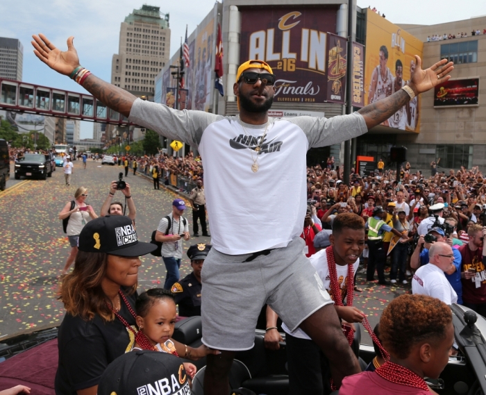 Cleveland Cavaliers Lebron James celebrates with the crowd during a parade to celebrate winning the 2016 NBA Championship in downtown Cleveland, Ohio, U.S. June 22, 2016.