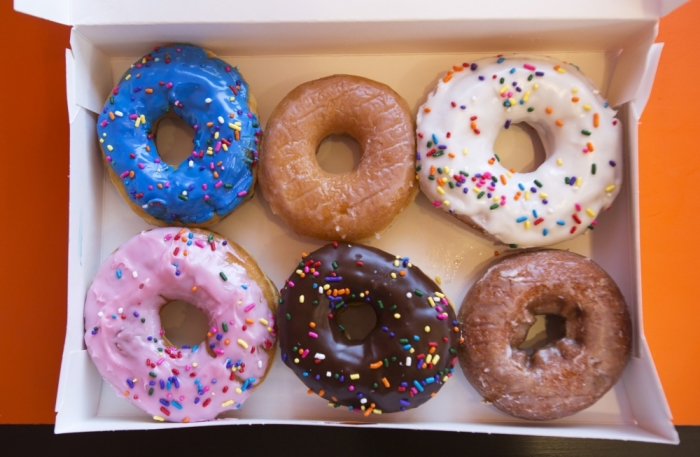 A box of donuts, (from top L clockwise) manager's special, traditional glazed, vanilla, pumpkin, chocolate and strawberry, is pictured at a newly opened Dunkin' Donuts store in Santa Monica, California, September 2, 2014.