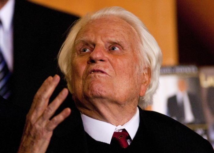 Billy Graham gestures while attending a book signing for former U.S. President George W. Bush's new book 'Decision Points' at the Billy Graham Library in Charlotte, North Carolina December 20, 2010.