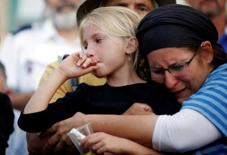 Relatives and friends mourn during the funeral of Israeli girl, Hallel Yaffa Ariel, 13, who was killed in a Palestinian stabbing attack in her home in the West Bank Jewish settlement of Kiryat Arba, at a cemetery in the West Bank city of Hebron June 30, 2016.
