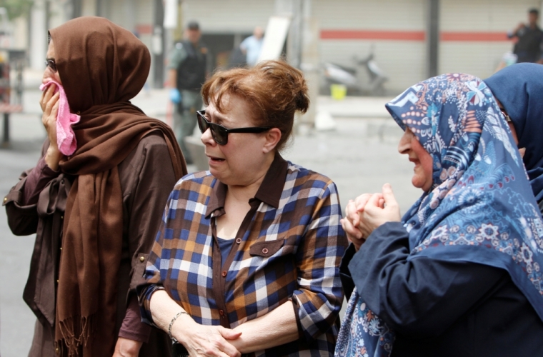 Women react at the site after a suicide car bomb attack at the shopping area of Karrada, a largely Shi'ite district, in Baghdad, Iraq, July 4, 2016.