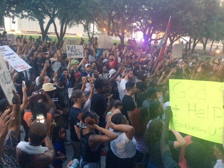 Marchers protest against police shootings of two black men in Louisiana and Minnesota during a demonstration in Dallas, Texas, July 7, 2016.