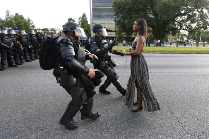 A demonstrator protesting the shooting death of Alton Sterling is detained by law enforcement near the headquarters of the Baton Rouge Police Department in Baton Rouge, Louisiana, U.S. July 9, 2016.