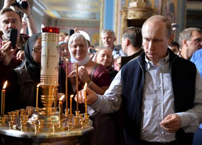 Russian President Vladimir Putin attends a religious service at the Cathedral of the Transfiguration of the Savior at Valaam Monastery, Russia, July 11, 2016.