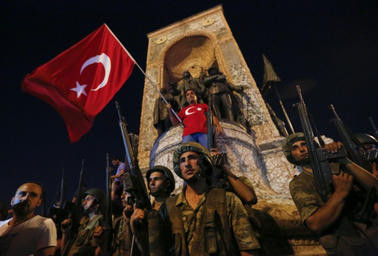 Turkish military stand in front of the Republic Monument at the Taksim Square in Istanbul, Turkey, July 16, 2016.