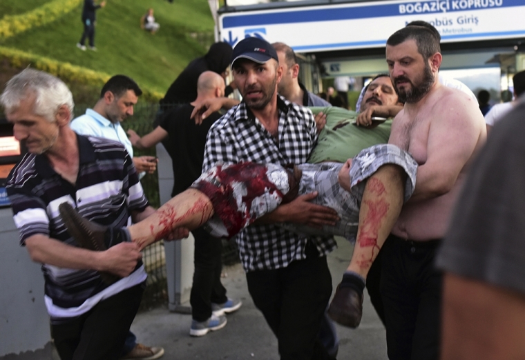 A wounded man is carried away during an attempted coup in Istanbul, Turkey, July 16, 2016.
