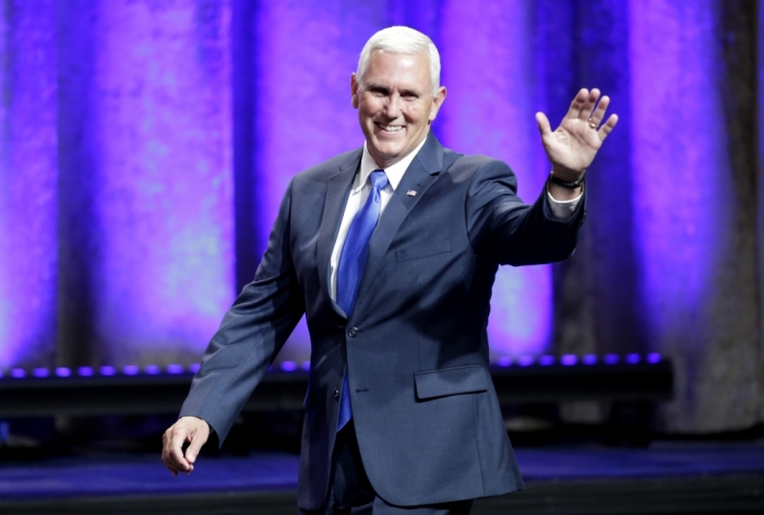 Indiana Governor Mike Pence waves as he arrives to be introduced as Republican U.S. presidential candidate Donald Trump's vice presidential running mate in New York City, July 16, 2016.