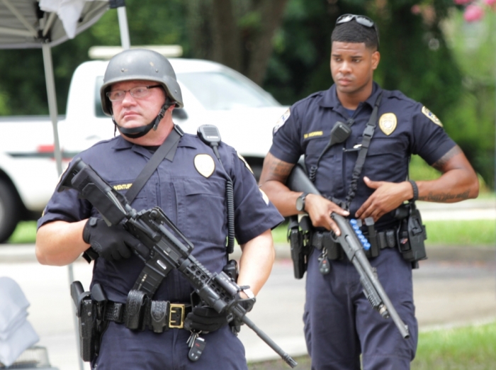 Police officers armed with rifles guard the entrance to Our Lady of the Lake Hospital after a fatal shooting of police officers in Baton Rouge, Louisiana, July 17, 2016.