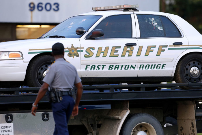 An East Baton Rouge Sheriff vehicle is seen with bullet holes in its windows near the scene where police officers were shot in Baton Rouge, Louisiana, U.S. July 17, 2016.