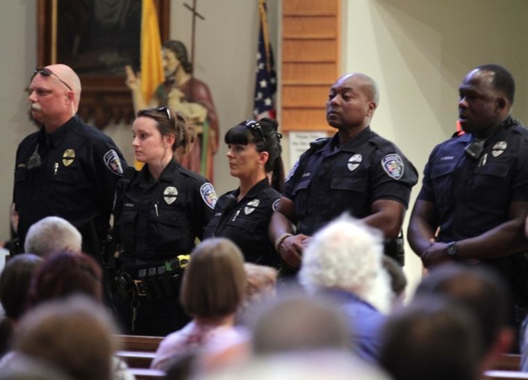 Police officers attend a church service after a fatal shooting of Baton Rouge policemen, at Saint John the Baptist Church in Zachary, Louisiana, July 17, 2016.