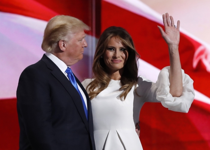 Melania Trump stands with her husband Republican U.S. presidential candidate Donald Trump at the Republican National Convention in Cleveland, Ohio, U.S. July 18, 2016.