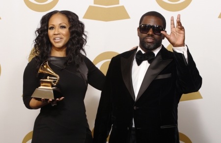 Erica Campbell and Warryn Campbell pose with their Grammy award for Best Gospel Song for "Go Get It" backstage at the 55th annual Grammy Awards in Los Angeles, California, February 10, 2013.