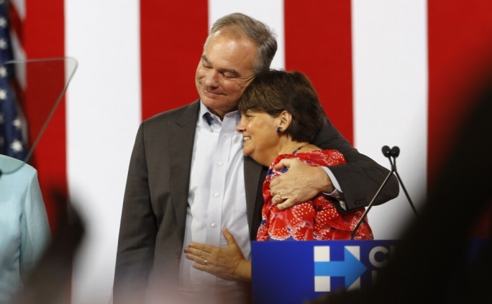 Democratic U.S. vice presidential candidate Senator Tim Kaine (D-VA) hugs his wife Anne (R) after being publicly introduced as her running-mate by Democratic U.S. presidential candidate Hillary Clinton during a campaign rally in Miami, Florida, U.S. July 23, 2016.
