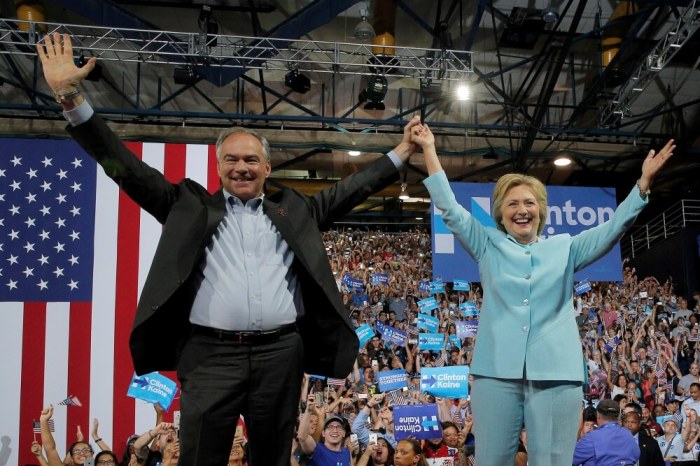 U.S. Democratic presidential candidate Hillary Clinton and Democratic vice presidential candidate Senator Tim Kaine take the stage at a campaign rally in Miami, Florida, U.S. July 23, 2016.