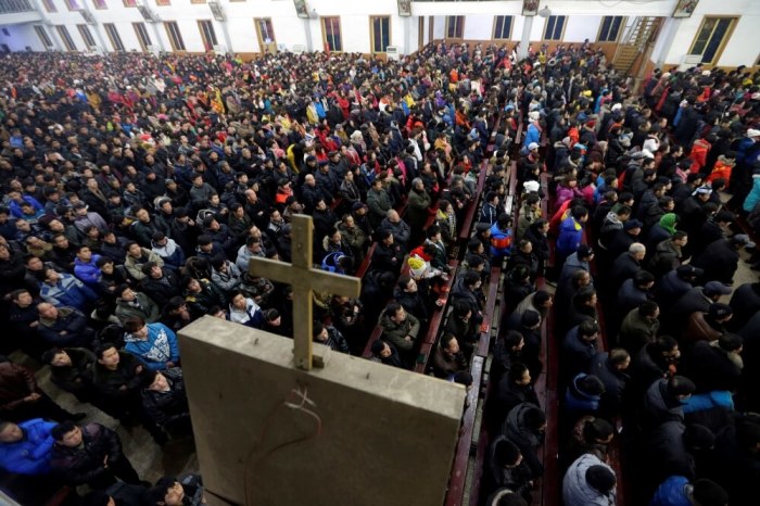 Catholics attend a Christmas eve mass at a Catholic church near the city of Taiyuan, Shanxi province, December 24, 2012.