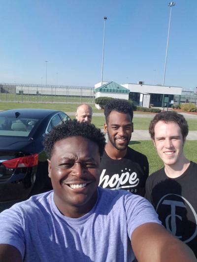 Pastor Derwin Gray and Transformers Church prison team associates take a photo after Gray baptized 20 men at the Lee Correctional Institution in Bishopville, South Carolina on July 23, 2016.