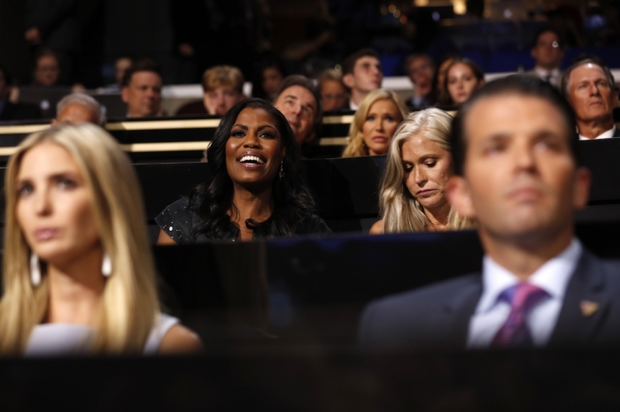 Television personality Omarosa (C) is seated behind Ivanka Trump and Donald trump Jr. at the Republican National Convention in Cleveland, Ohio. July 19, 2016.