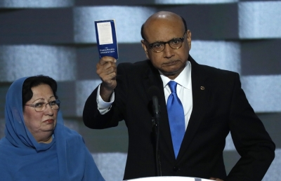 Khizr Khan, whose son, Humayun S. M. Khan was one of 14 American Muslims who died serving in the U.S. Army in the 10 years after the 9/11 attacks, offers to loan his copy of the Constitution to Republican U.S. presidential nominee Donald Trump, as he speaks while a relative looks on during the last night of the Democratic National Convention in Philadelphia, Pennsylvania, July 28, 2016.