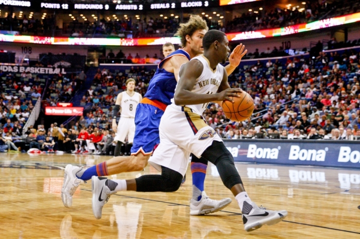 New Orleans Pelicans guard Jrue Holiday (11) drives past New York Knicks center Robin Lopez (8) during the second half of a game at the Smoothie King Center. The Pelicans defeated the Knicks 99-91, New Orleans, Louisiana, March 28, 2016.