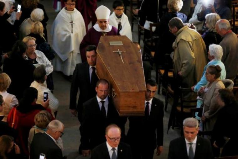 Pallbearers carry the coffin of slain French parish priest Father Jacques Hamel after a funeral ceremony at the Cathedral in Rouen, France, August 2, 2016.