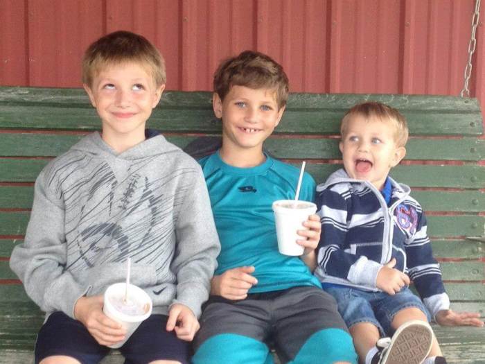 Caleb Schwab, 10, makes a funny face alongside two of his brothers in this 2012 photo including his older brother Nathan (C) who is now 12.
