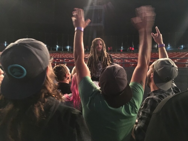Brian Head Welch preaches to concert attendees in Mountain View, California.