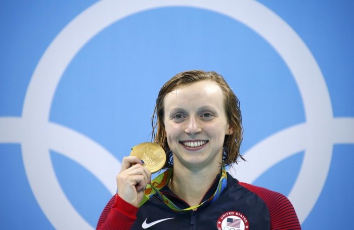 United States Olympian Katie Ledecky poses with her gold medal after winning the Woman's 200-meter freestyle on August 9, 2016 in Rio de Janeiro, Brazil.