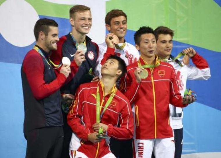 Men's Synchronized 10m Platform Victory Ceremony at Maria Lenk Aquatics Center in Rio de Janeiro on August 08, 2016. Team USA divers are the silver medal recipients on the left, (David Boudia, Steele Johnson).