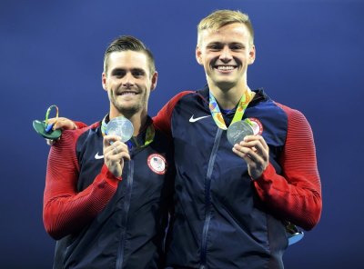 David Boudia and Steele Johnson (L-R) of team USA pose with their silver medals during the Men's Synchronised 10m Platform Victory Ceremony at the Maria Lenk Aquatics Centre in Rio de Janeiro, Brazil, on August 8, 2016.