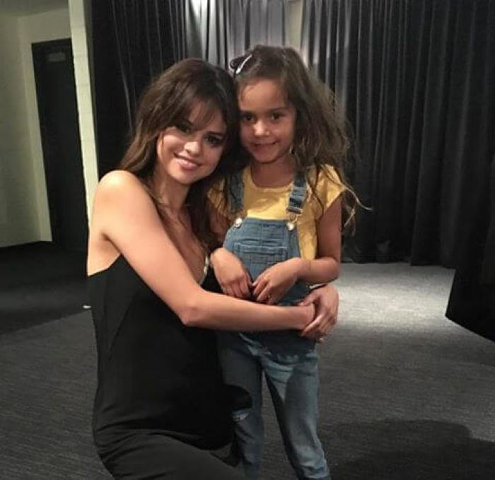 Selena Gomez poses with the granddaughter of Hillsong pastor Brian Houston, August 2016.
