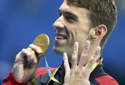 Michael Phelps of team USA poses with his gold medal at the 2016 Rio Olympics Men's 200m Individual Medley Victory Ceremony at the Olympic Aquatics Stadium in Rio de Janeiro, Brazil, August 11, 2016.