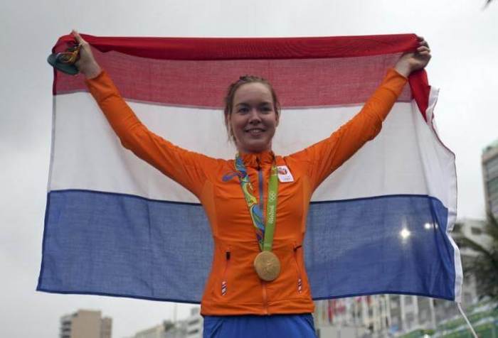 Anna van der Breggen (NED) of Netherlands celebrates winning the women's road race.