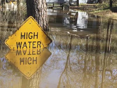 Credit : A high water sign is submerged near Lake Bistineau in Webster Parish, Louisiana. The death toll from storms in Southern U.S. states rose to five as storm-weary residents of Louisiana and Mississippi watched for more flooding on Monday from drenching rains