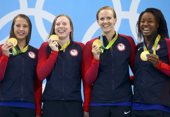 Gold medalists Kathleen Baker, Lilly King, Dana Vollmer and Simone Manuel of USA pose with their medals after winning the women's 4x100m medley relay at 2016 Rio Olympics in Rio de Janeiro, Brazil on August 13, 2016.