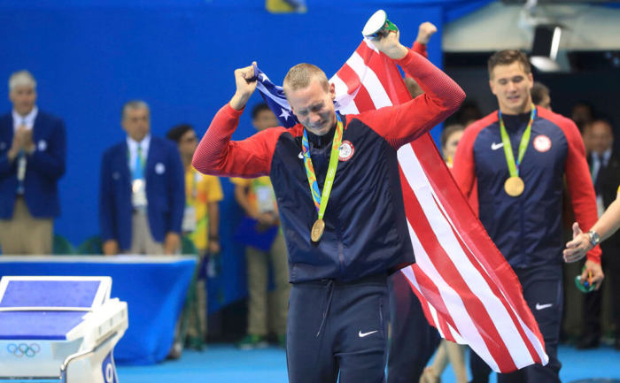 Caeleb Dressel of USA cries after receiving his gold medal for the men's 4 x 100m freestyle relay in Rio de Janeiro, Brazil on August 7, 2016.