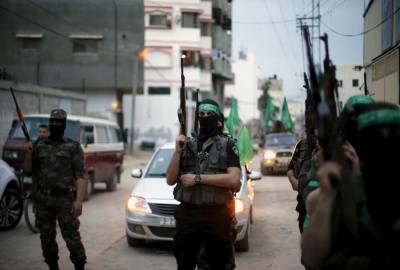 Palestinian Hamas militants take part in a rally marking the twelfth anniversary of the death of late Hamas leader Sheikh Ahmed Yassin, who was killed in an Israeli attack in Gaza City, March 23, 2016.
